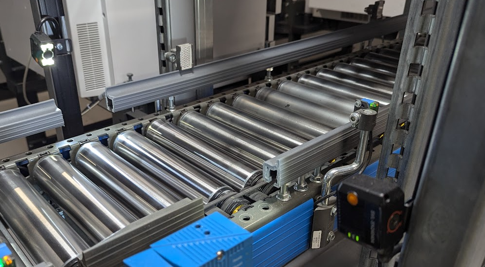 ToteTracker system on a conveyor belt with barcode scanner